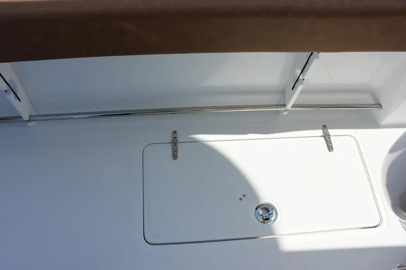 Slide: The Image of 2025 Sea Hunt Gamefish 28 Forward Seating deck with storage compartment and railing. - 34