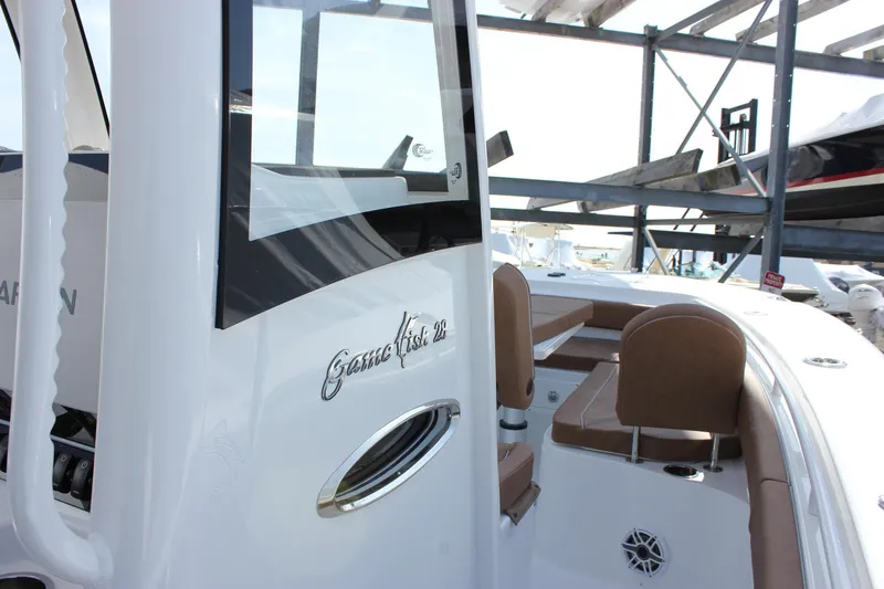 Slide: The Image of 2025 Sea Hunt Gamefish 28 Forward Seating boat, featuring sleek design and comfortable seating. - 39
