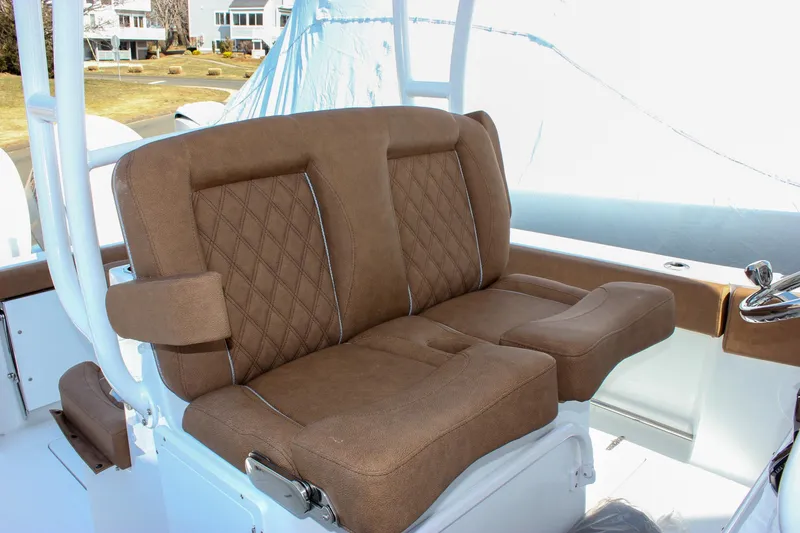 Slide: The Image of 2025 Sea Hunt Gamefish 28 Forward Seating with brown cushioned seats. - 40