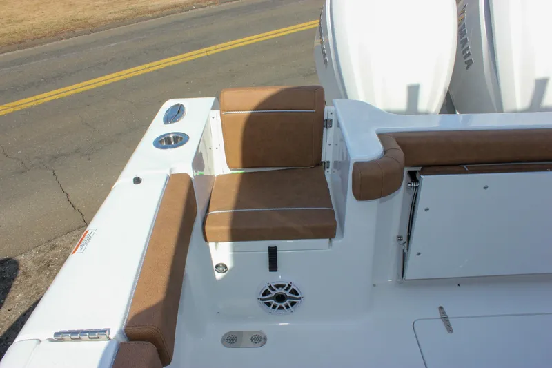 Slide: The Image of 2025 Sea Hunt Gamefish 28 Forward Seating boat with brown cushioned seats and white deck. - 9