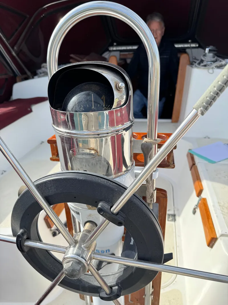 Slide: The Image of 1984 Endeavour 38 sailboat docked in a marina under clear blue skies. - 4