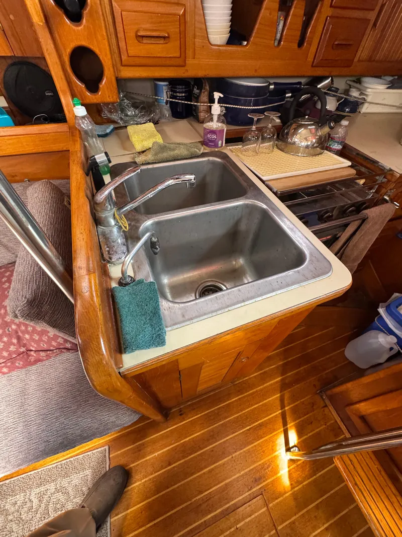 Slide: The Image of Electrical control panel of a 1984 Endeavour 38 yacht, featuring 12V DC and 116V AC systems. - 6