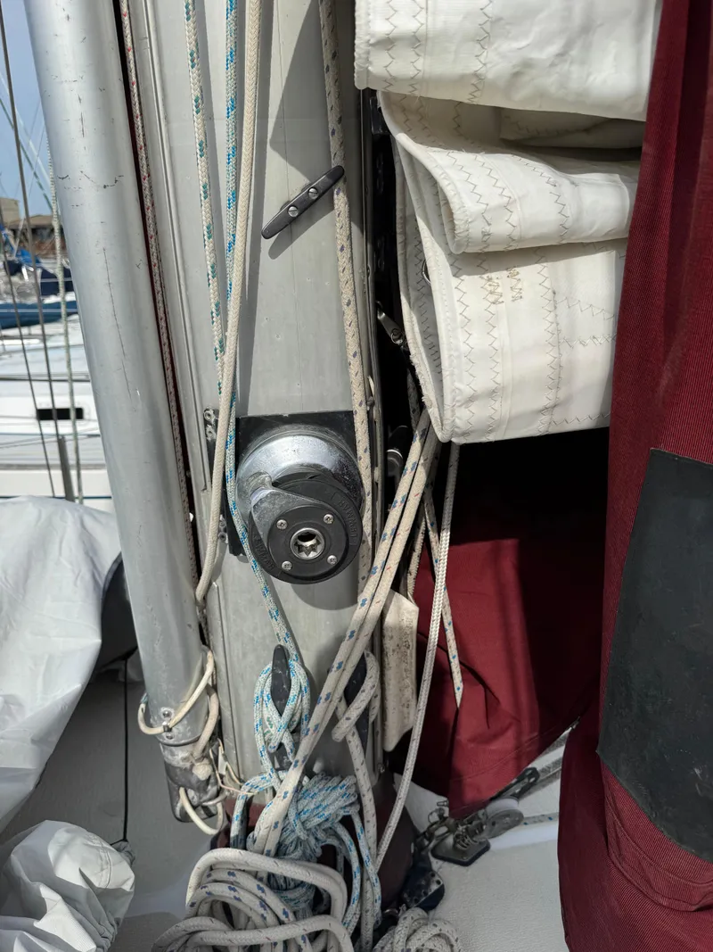 Slide: The Image of Engine of a 1984 Endeavour 38 sailboat, showcasing belts and hoses. - 8