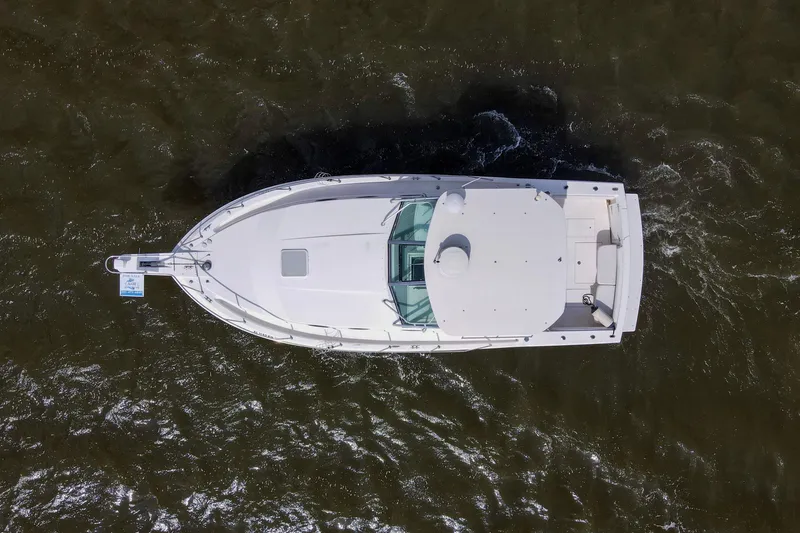 Slide: The Image of Aerial view of 2004 Wellcraft 330 Coastal boat on water. - 7