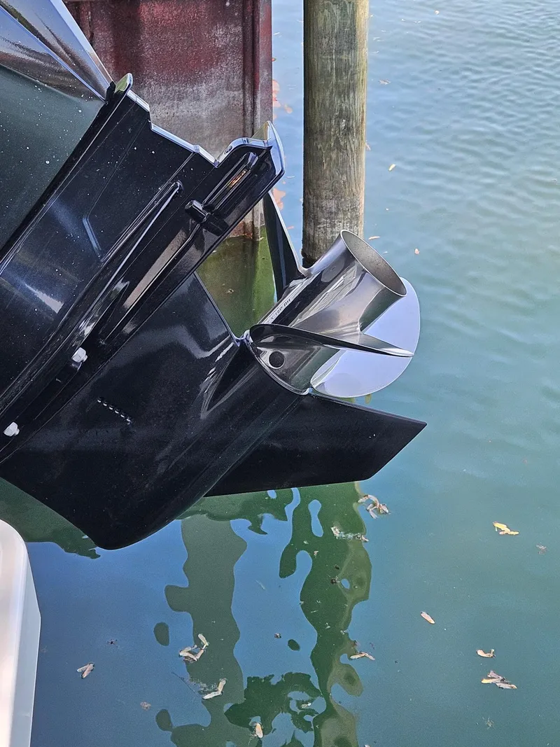 Slide: The Image of 2022 Boston Whaler 210 Montauk boat dashboard with steering wheel and controls. - 10