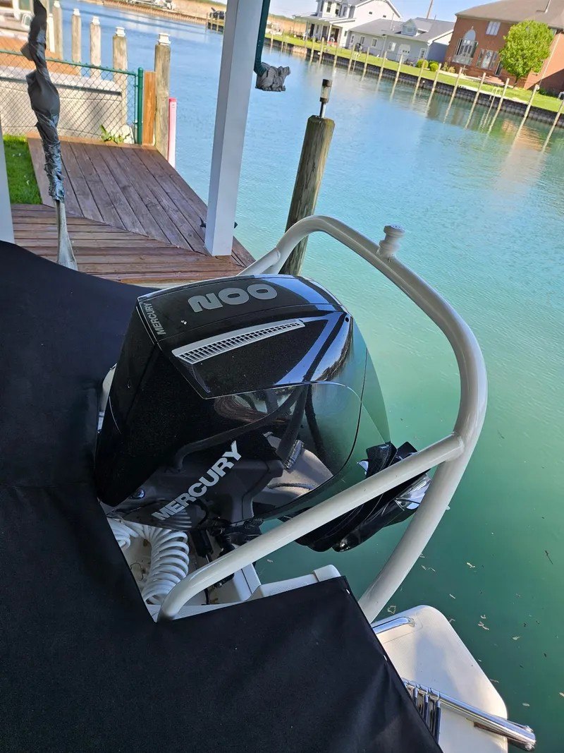Slide: The Image of Storage compartment in 2022 Boston Whaler 210 Montauk with portable toilet and life jackets. - 14