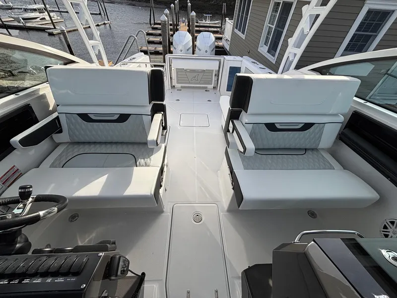 Slide: The Image of 2025 Blackfin 272 DC boat interior with dual seating and modern design. - 15
