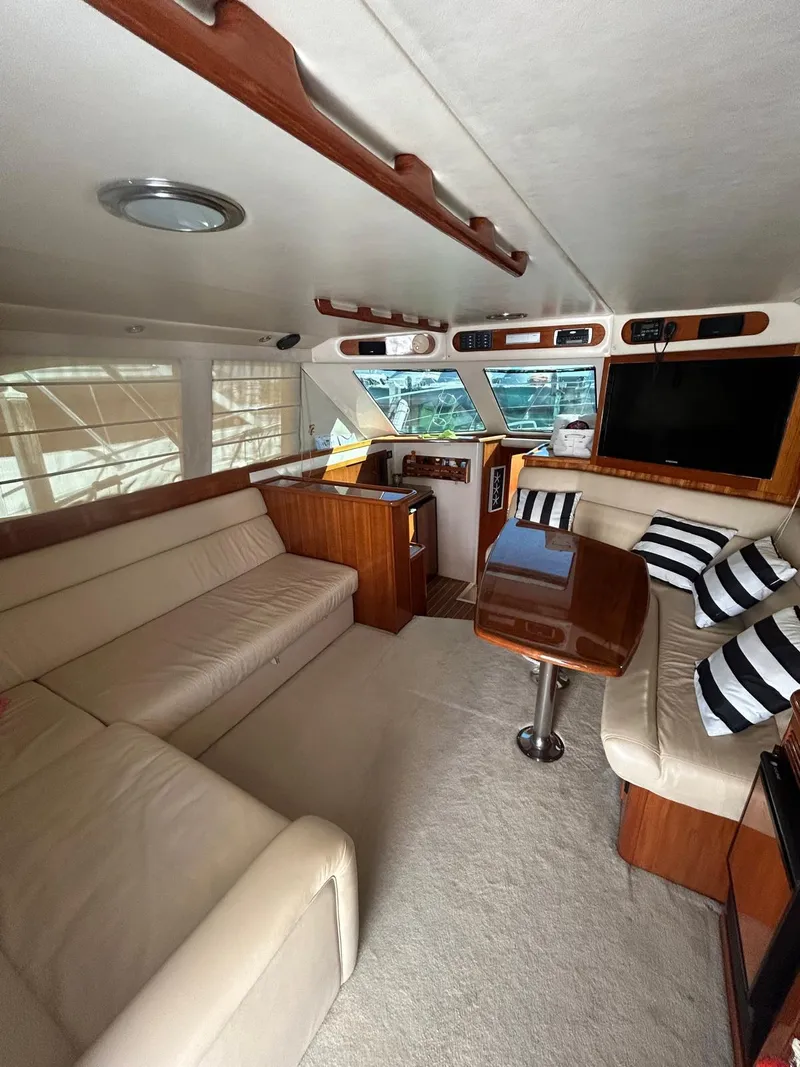 Slide: The Image of Luxurious 2004 Riviera 40 yacht interior with plush seating and modern amenities. - 5