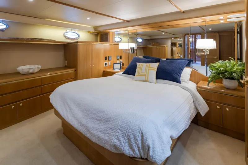 Slide: The Image of Luxurious bedroom in 1999 West Bay 58 Pilothouse Motor Yacht with elegant wood finishes. - 18