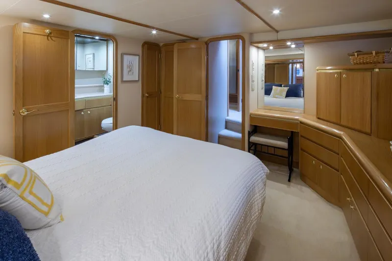 Slide: The Image of Luxurious bedroom in 1999 West Bay 58 Pilothouse Motor Yacht with elegant wood cabinetry. - 19