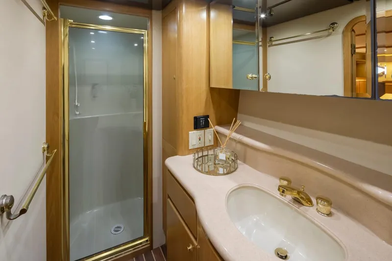 Slide: The Image of Luxurious bathroom in 1999 West Bay 58 Pilothouse Motor Yacht with shower and vanity. - 21
