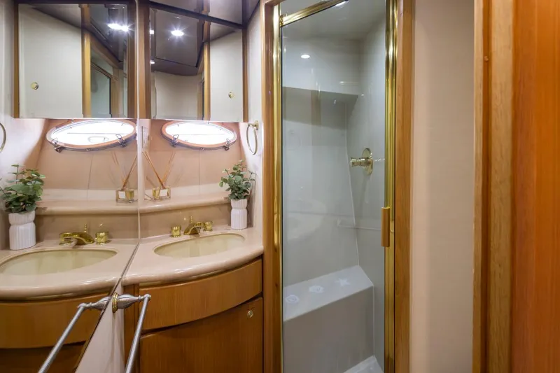Slide: The Image of Luxurious bathroom in 1999 West Bay 58 Pilothouse Motor Yacht with shower and vanity. - 27