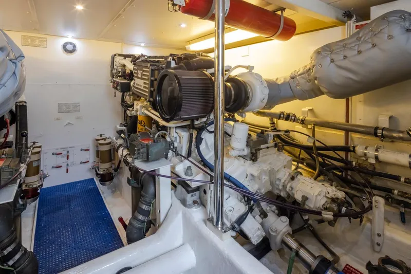 Slide: The Image of Engine room of 1999 West Bay 58 Pilothouse Motor Yacht, showcasing machinery and equipment. - 35
