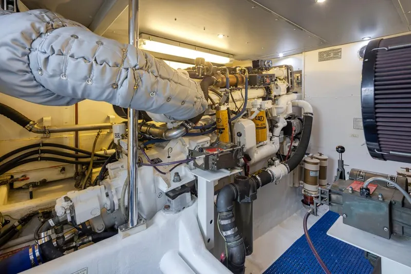 Slide: The Image of Engine room of 1999 West Bay 58 Pilothouse Motor Yacht, showcasing mechanical components. - 37