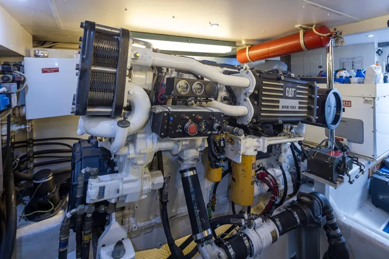 Slide: The Image of Engine room of 1999 West Bay 58 Pilothouse Motor Yacht, featuring CAT marine engine. - 38