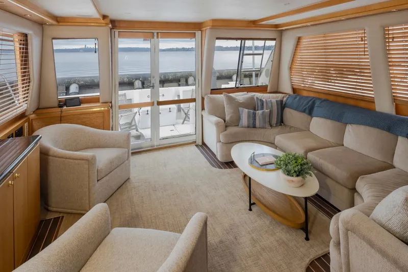 Slide: The Image of Luxurious interior of 1999 West Bay 58 Pilothouse Motor Yacht with elegant seating and ocean view. - 41