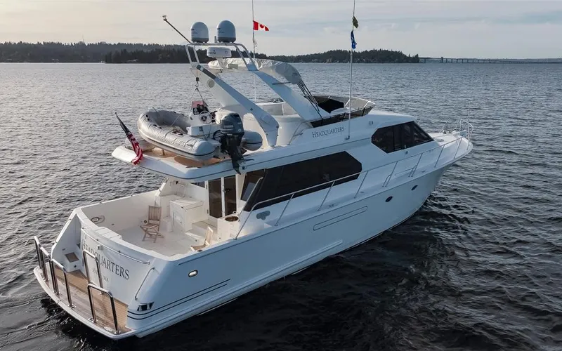 Slide: The Image of 1999 West Bay 58 Pilothouse Motor Yacht cruising on open water. - 43