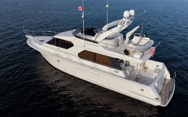 Slide: The Image of 1999 West Bay 58 Pilothouse Motor Yacht cruising on open water. - 44