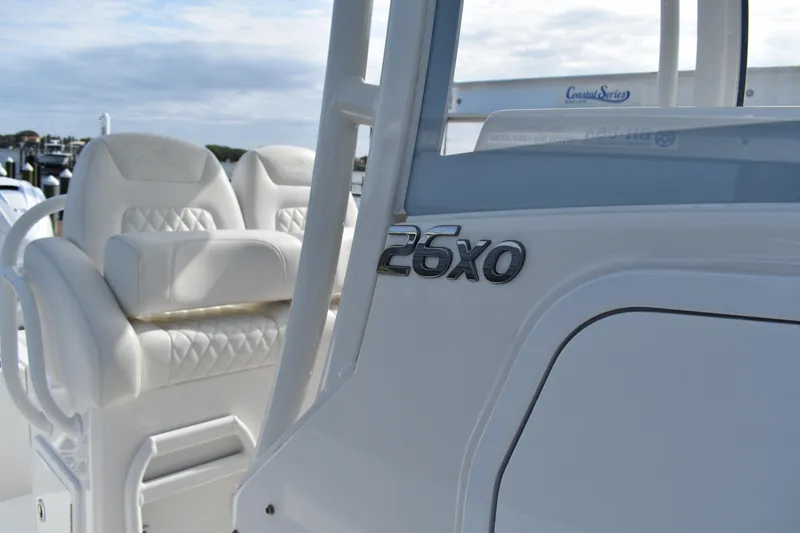 Slide: The Image of 2024 Regulator 26XO boat interior with seating and model emblem. - 12