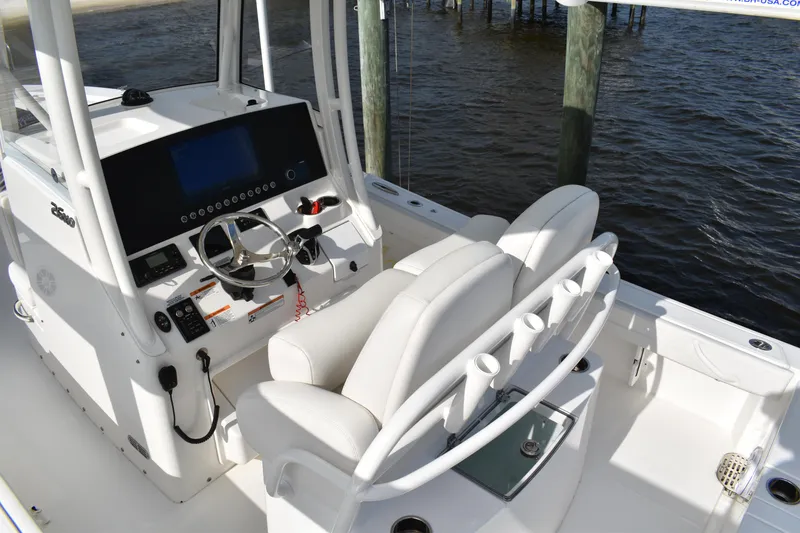 Slide: The Image of 2024 Regulator 26XO boat interior with modern helm and seating. - 14