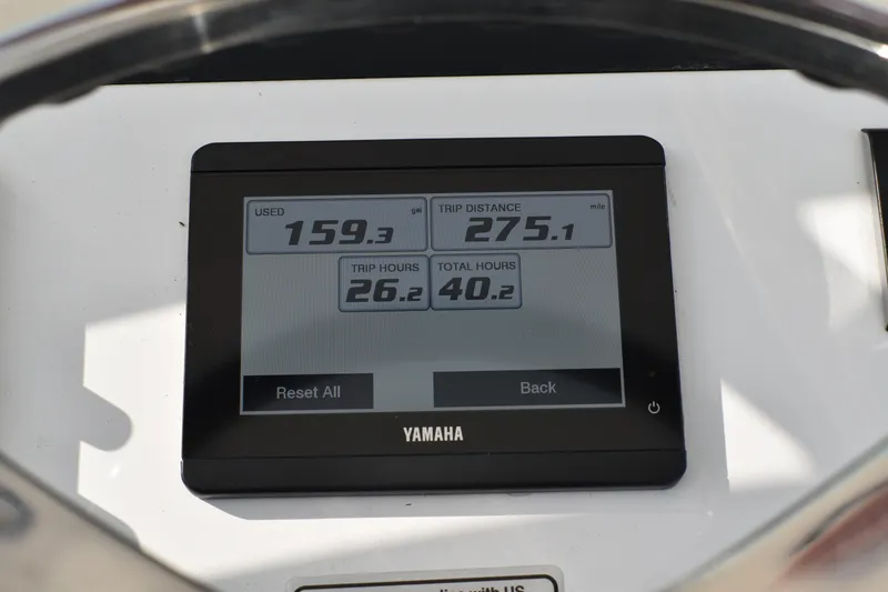 Slide: The Image of Yamaha display on 2024 Regulator 26XO showing trip data and hours. - 16