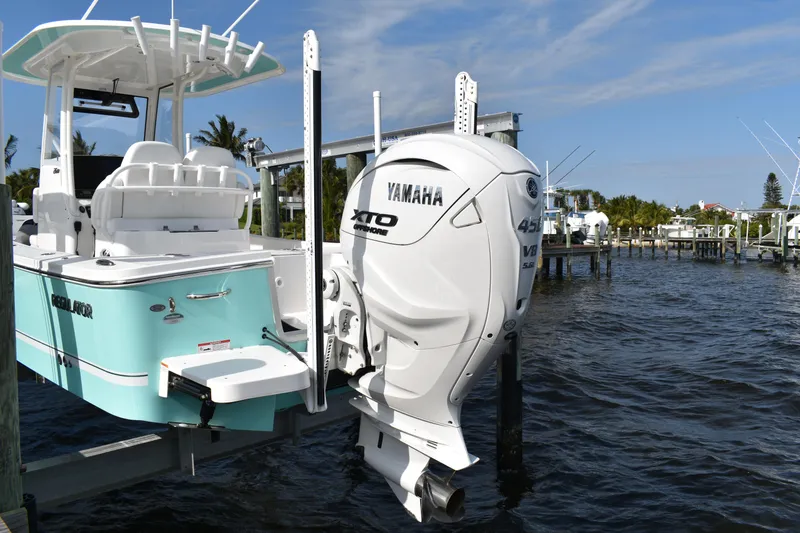 Slide: The Image of 2024 Regulator 26XO boat with Yamaha XTO 425 V8 engine docked by the water. - 21