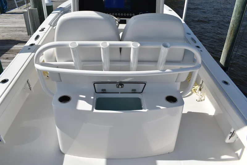 Slide: The Image of 2024 Regulator 26XO boat interior with dual seats and rod holders. - 5
