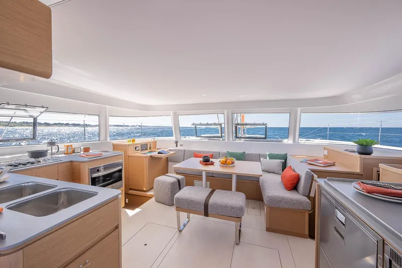 Slide: The Image of Luxurious interior of 2025 Excess 14 catamaran with modern kitchen and ocean view. - 12