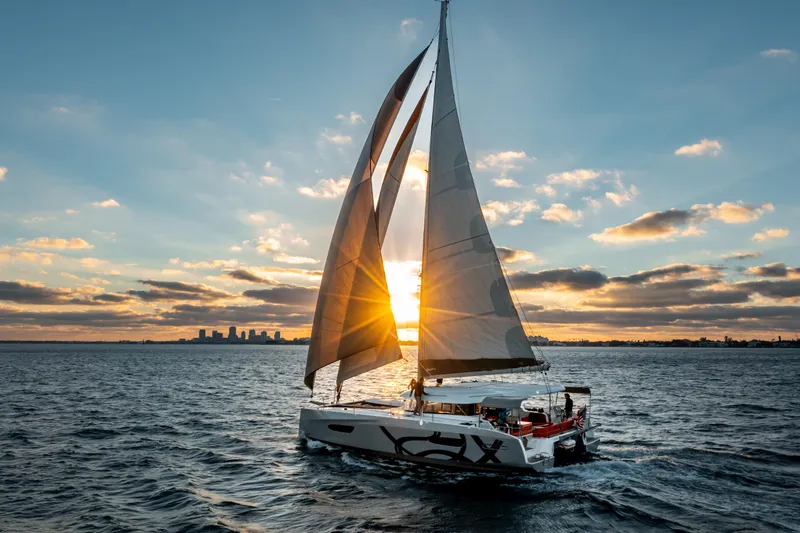Slide: The Image of Sailing yacht Excess 14, 2025 model, at sunset on open water. - 6