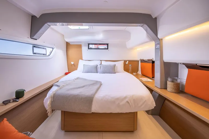 Slide: The Image of Luxurious cabin interior of 2025 Excess 14 yacht with cozy bed and modern design. - 14