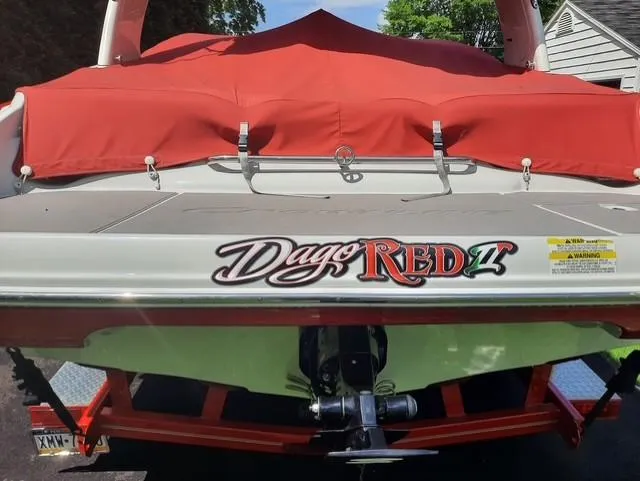 Slide: The Image of 2015 Crownline 235 SS boat with red cover and custom "Dago Red II" decal. - 3