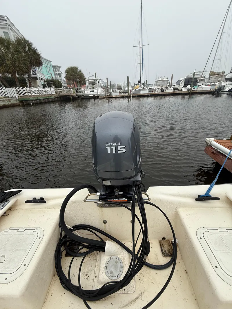 Slide: The Image of 2005 Jones Brothers 22 Bateau boat with Yamaha 115 outboard motor at marina. - 7