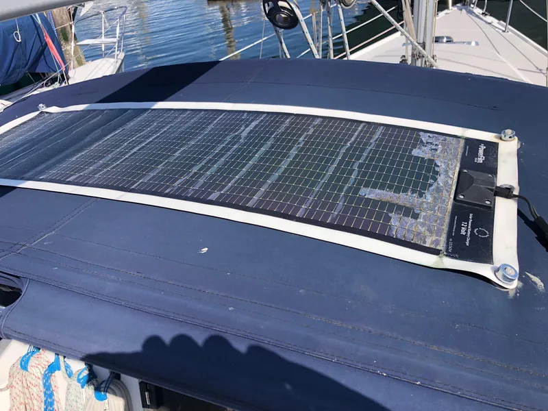 Slide: The Image of Solar panel on 2005 Catalina 310 sailboat, mounted on blue canvas cover. - 13