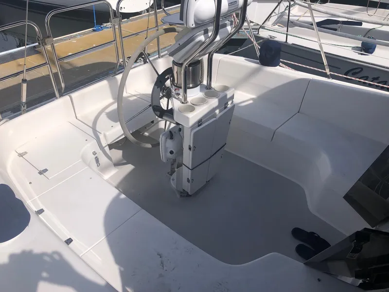 Slide: The Image of Cockpit of a 2005 Catalina 310 sailboat with steering wheel and navigation equipment. - 20