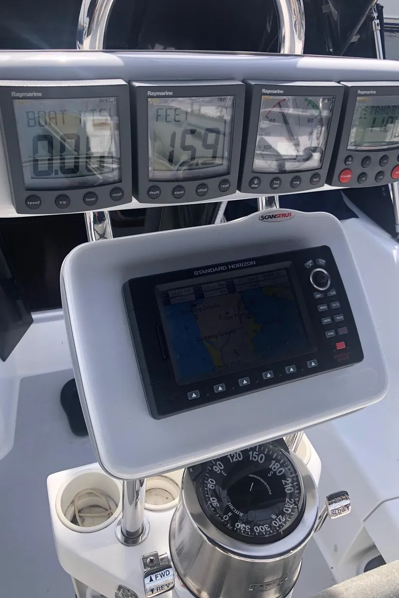 Slide: The Image of Control panel of a 2005 Catalina 310 sailboat with navigation instruments. - 21