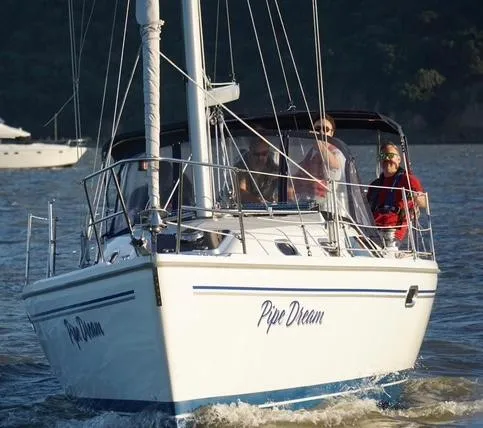 Slide: The Image of 2005 Catalina 310 sailboat "Pipe Dream" cruising on a sunny day. - 23