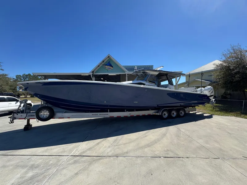 The Image of 2018 Nor-Tech 452 Super Fish boat on trailer, parked outdoors under clear blue sky. - 1