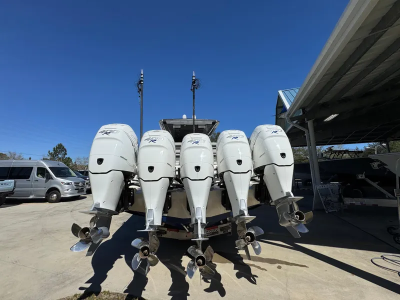 Slide: The Image of 2018 Nor-Tech 452 Super Fish with five powerful outboard engines, parked outdoors. - 18