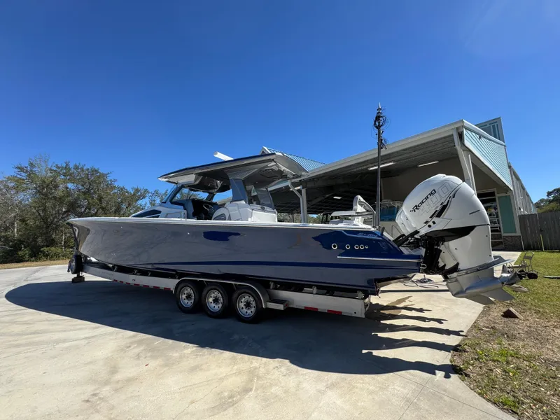 Slide: The Image of 2018 Nor-Tech 452 Super Fish boat on trailer, parked outdoors. - 20
