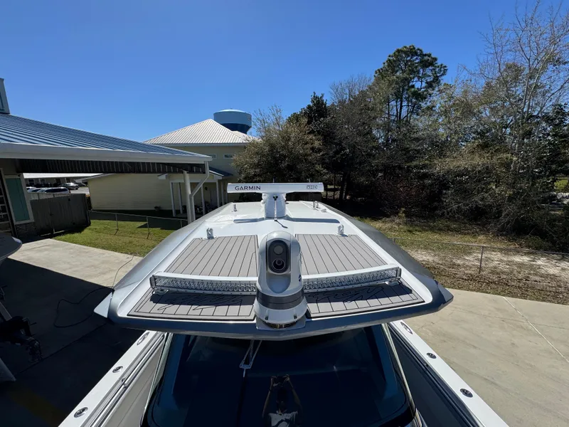 Slide: The Image of 2018 Nor-Tech 452 Super Fish boat with Garmin equipment, docked outdoors. - 26