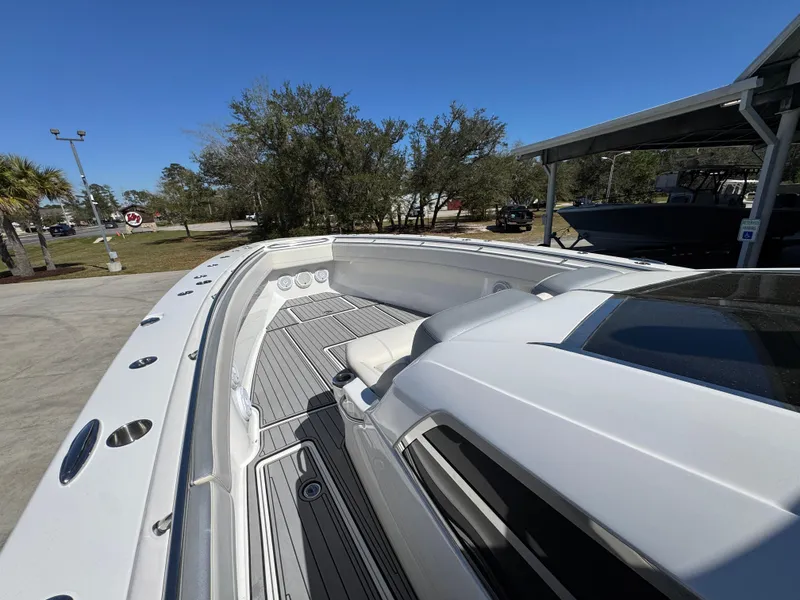 Slide: The Image of 2018 Nor-Tech 452 Super Fish boat with sleek deck design under clear blue sky. - 27