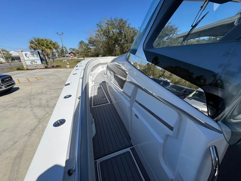 Slide: The Image of 2018 Nor-Tech 452 Super Fish boat, sleek design, docked outdoors under clear blue sky. - 31