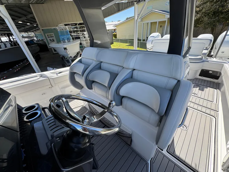 Slide: The Image of 2018 Nor-Tech 452 Super Fish boat interior with plush seating and sleek steering wheel. - 37