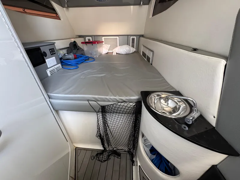 Slide: The Image of 2018 Nor-Tech 452 Super Fish cabin interior with bed, sink, and storage. - 41