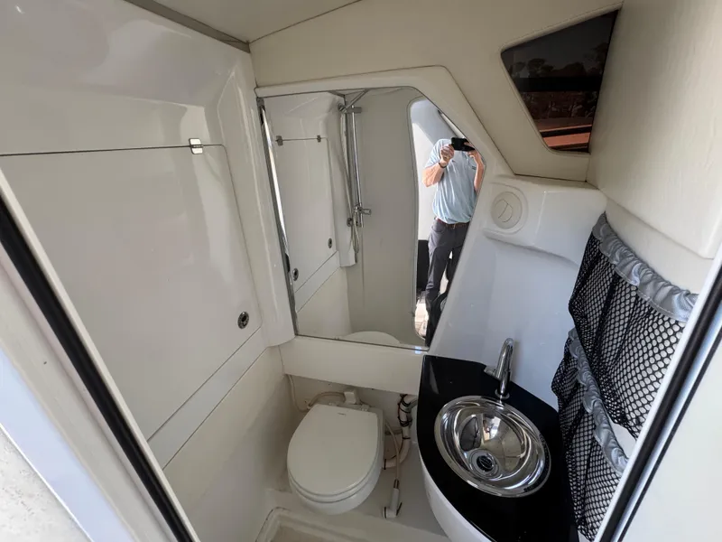 Slide: The Image of 2018 Nor-Tech 452 Super Fish boat bathroom with sink and toilet. - 44