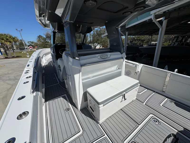 Slide: The Image of 2018 Nor-Tech 452 Super Fish boat interior with seating and storage, featuring sleek design and spacious deck. - 45