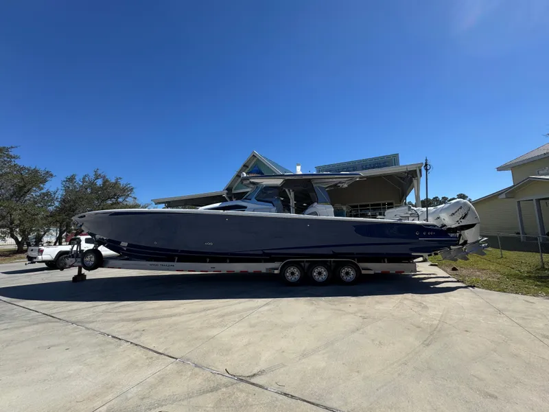 Slide: The Image of 2018 Nor-Tech 452 Super Fish boat on trailer under clear blue sky. - 5