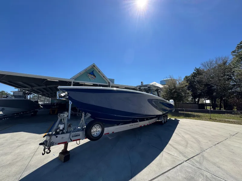 Slide: The Image of 2018 Nor-Tech 452 Super Fish boat on trailer under clear blue sky. - 6