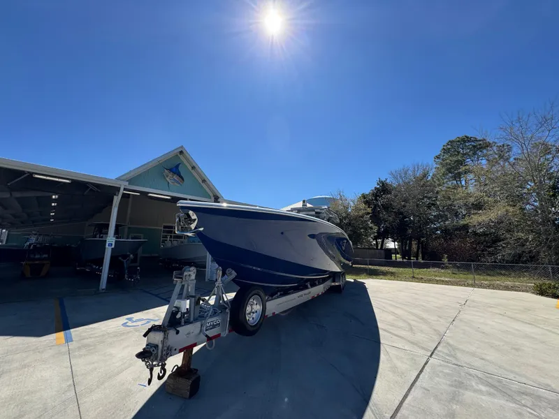 Slide: The Image of 2018 Nor-Tech 452 Super Fish boat on trailer under clear blue sky. - 7