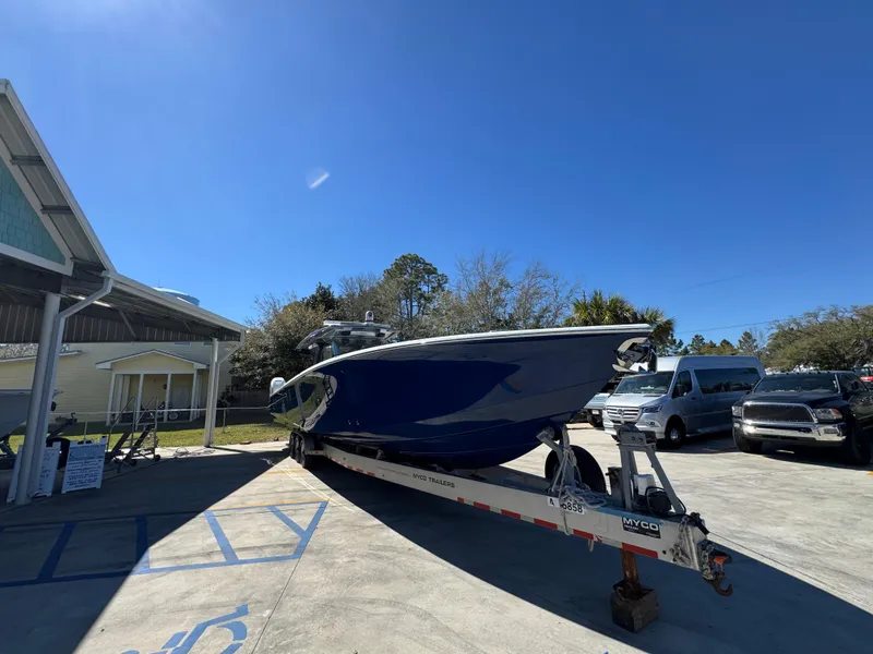 Slide: The Image of 2018 Nor-Tech 452 Super Fish boat on trailer in sunny outdoor setting. - 9